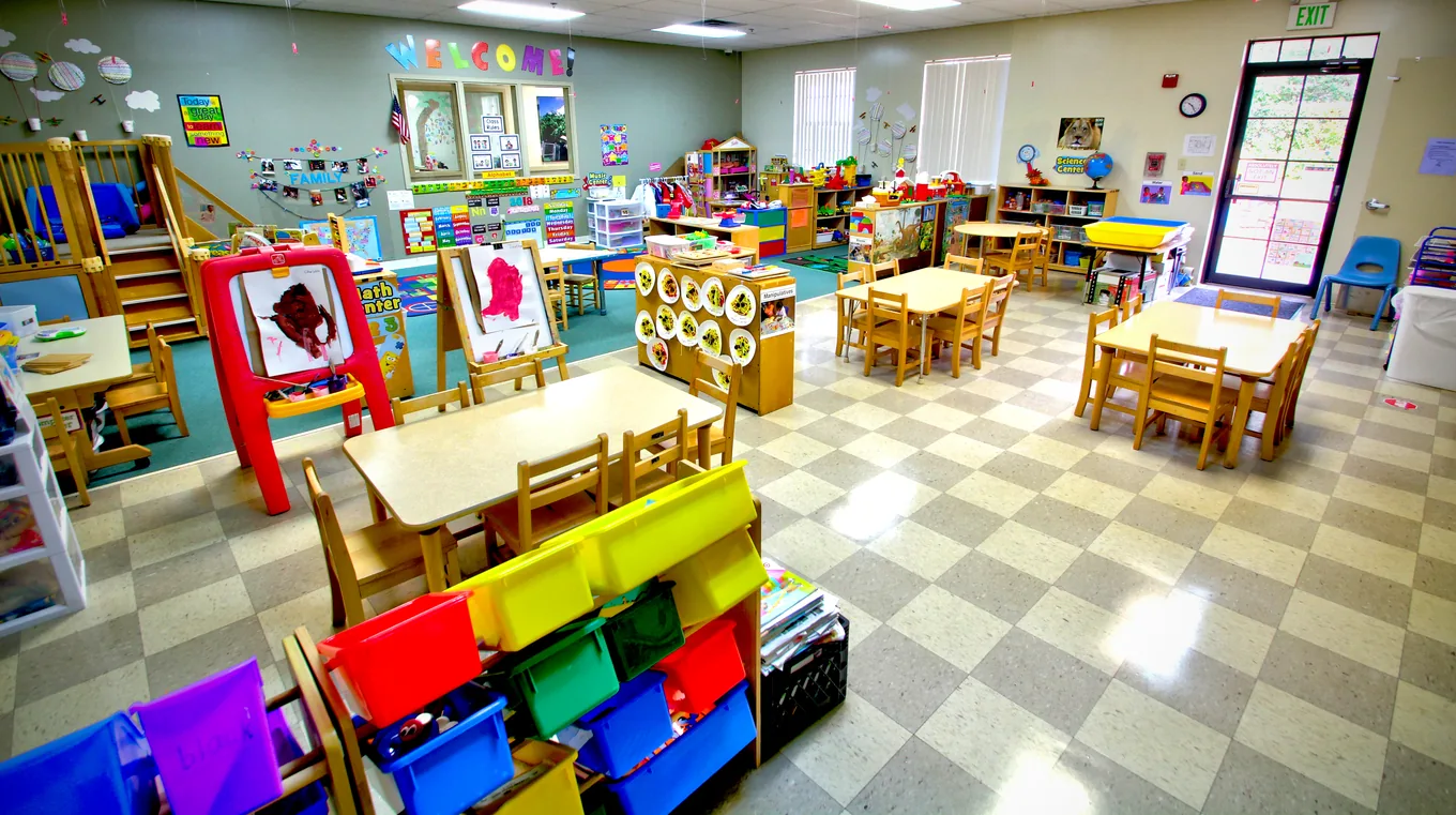 A classroom with organized activity stations and colorful storage bins