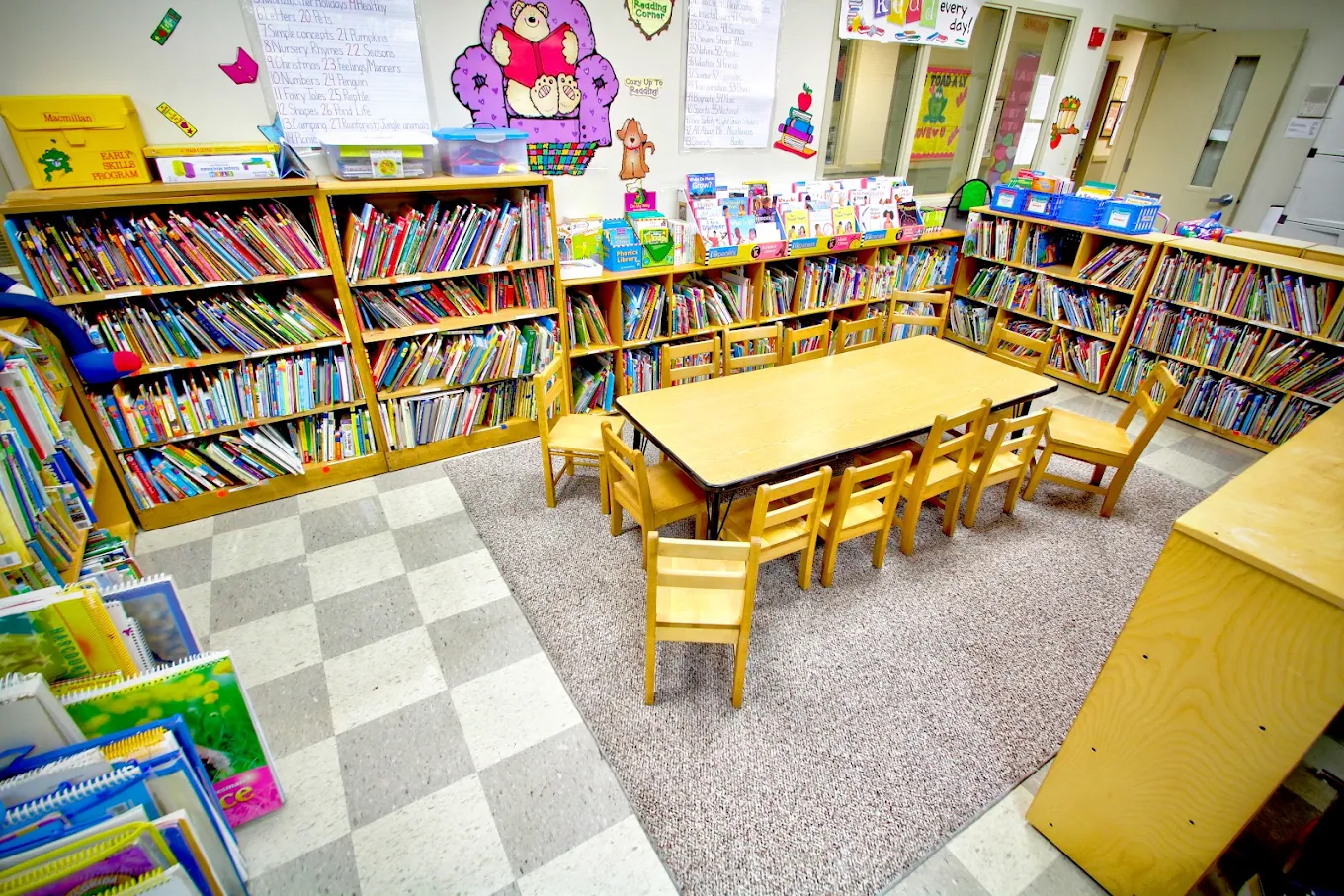 Classroom reading corner lined with bookshelves